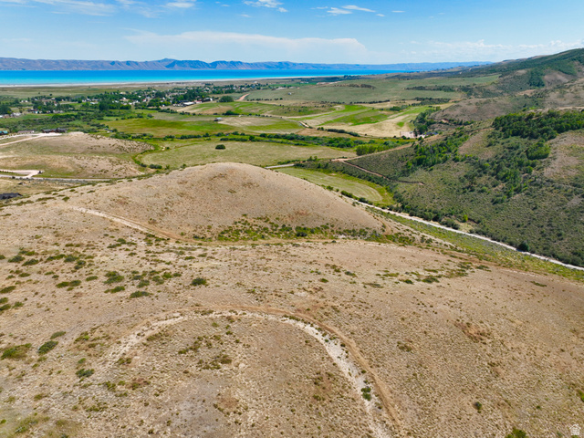 160 Dry Canyon St. Charles, ID 83272 - Photo 50 of 63 Expansive undeveloped land with a distant lake, verdant fields, and rolling hills