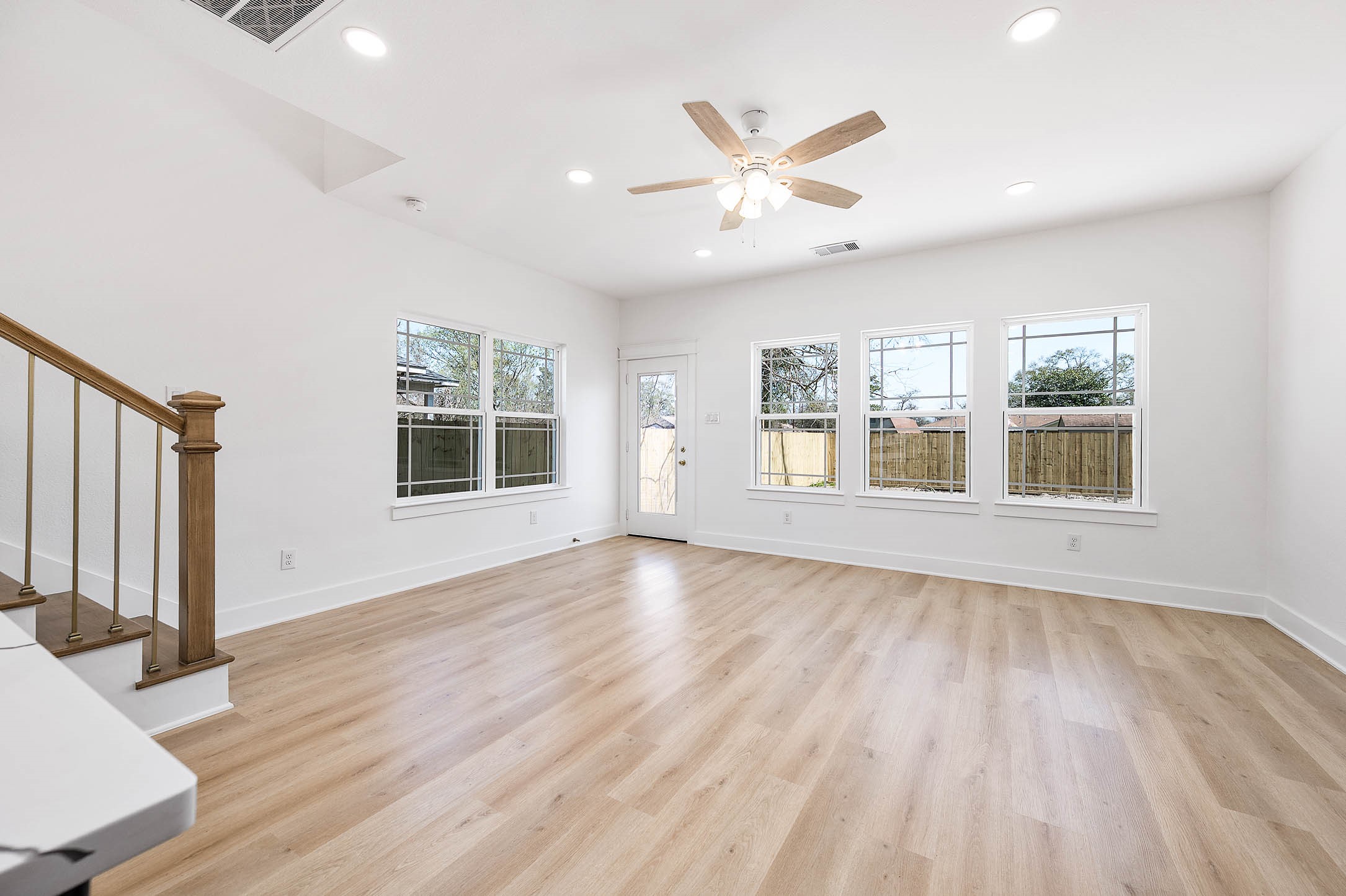 8602 Hoffman Street Houston, TX 77016 - Photo 15 of 30 Bright living area with plenty of natural light and wood-style flooring.