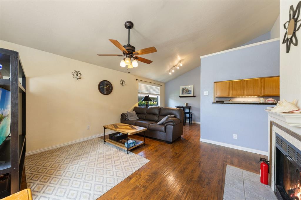 2240 Tarpley Road, Unit 411 Carrollton, TX 75006 - Photo 2 of 28 a living room with furniture and a flat screen tv