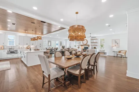 a view of a dining area with furniture and wooden floor