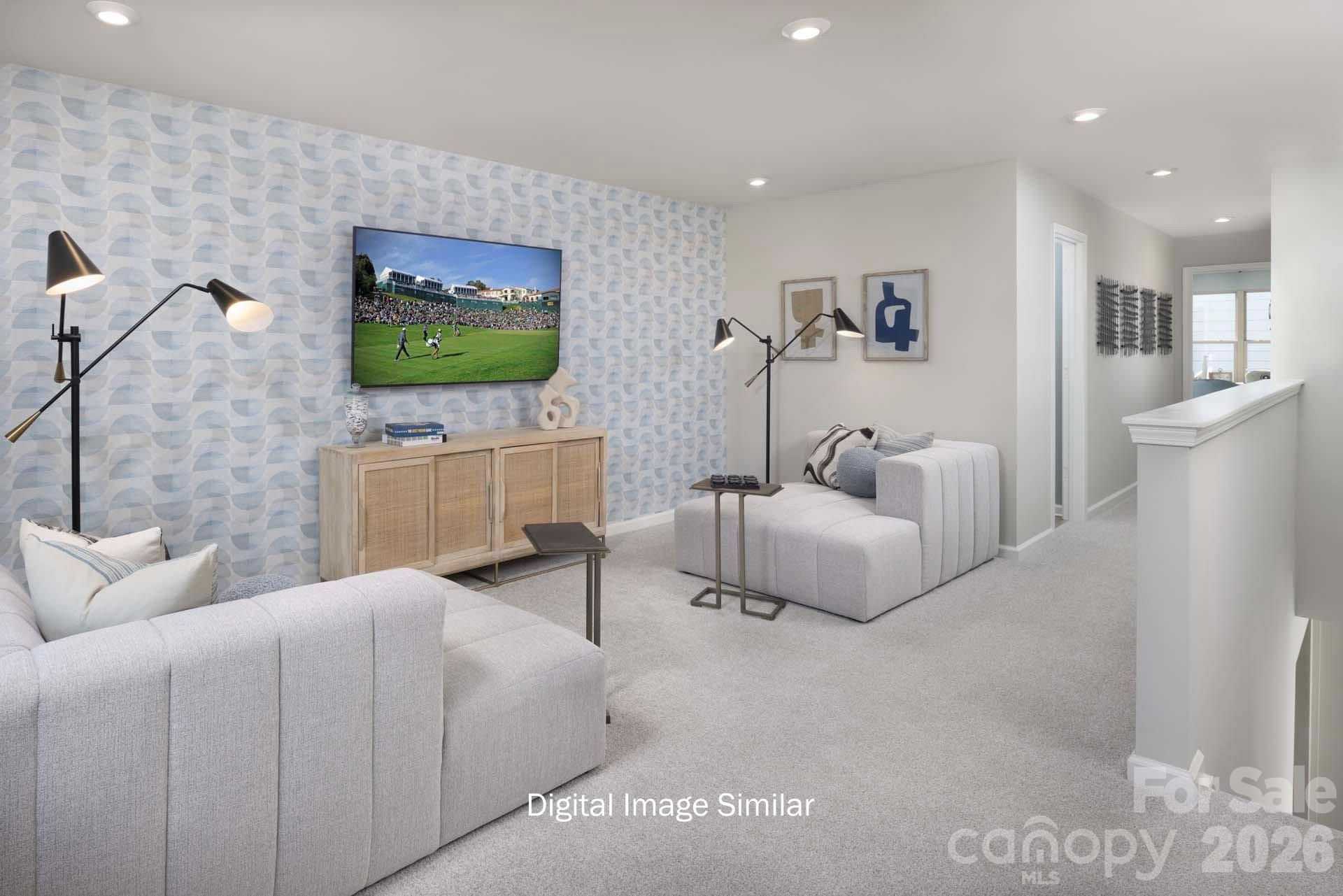 2550 Mabel Lane Monroe, NC 28110 - Photo 22 of 25 a living room with furniture and a flat screen tv