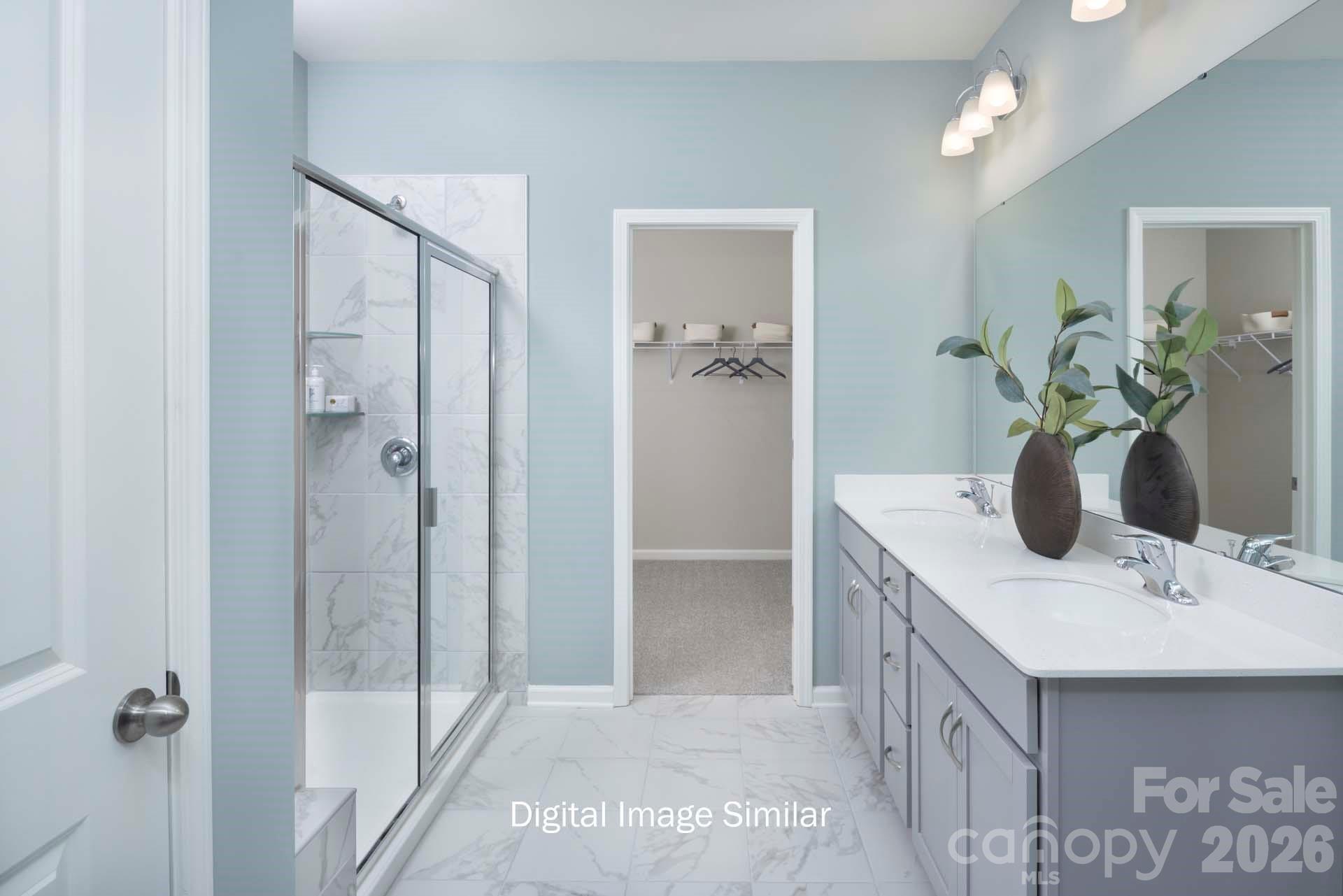 2550 Mabel Lane Monroe, NC 28110 - Photo 23 of 25 a bathroom with a sink a mirror and a shower