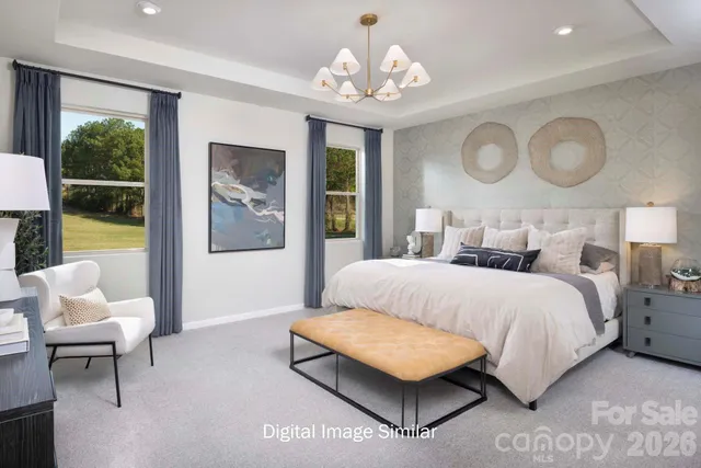 a bedroom with a bed lamps and window