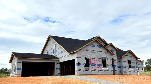 a view of house with yard and entertaining space