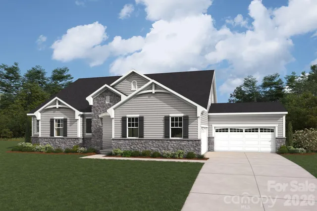 a view of house with yard and green space