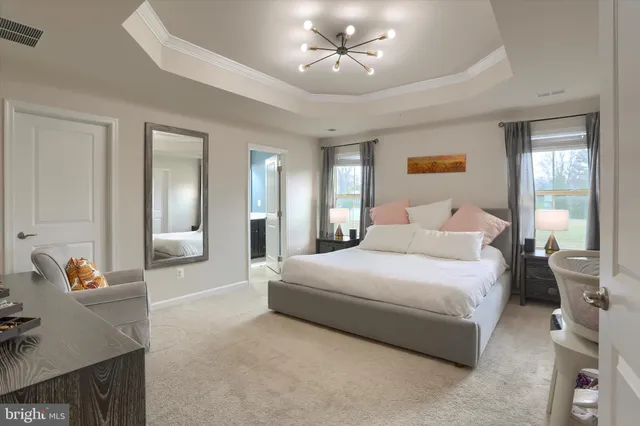 a bedroom with furniture and window