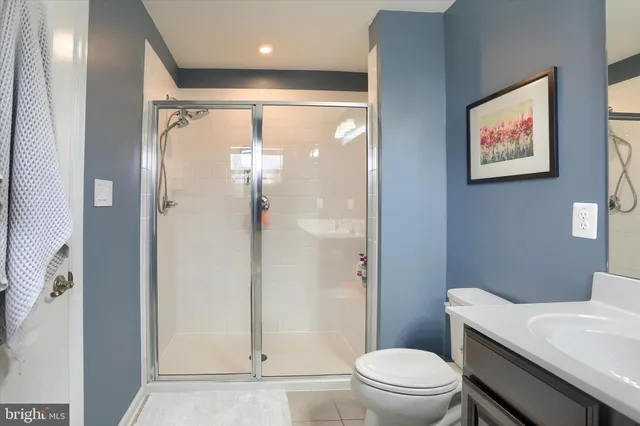 a bathroom with a sink vanity tub and a mirror