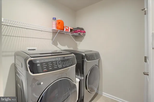 a view of a patio with couches and a table and chairs with garden view