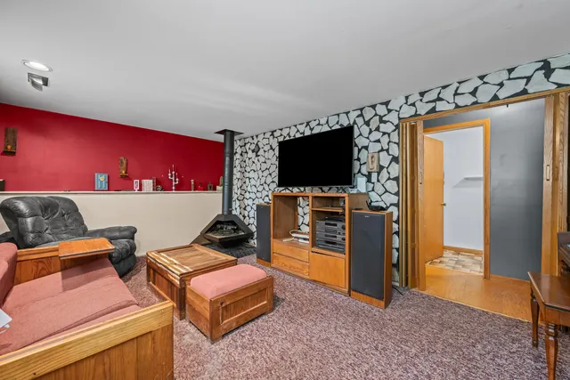 a room with furniture and a flat screen tv