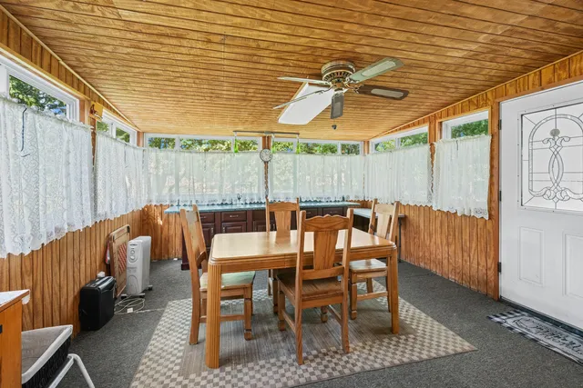 a view of a chairs and table in the patio