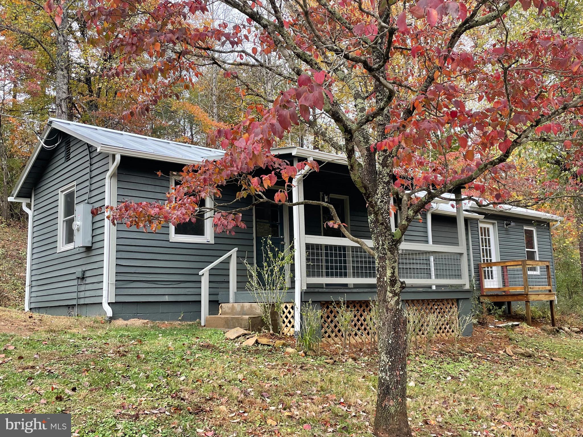 240 Whorton Hollow Road Castleton, VA 22716 - Photo 21 of 37 front view of a house with a small yard