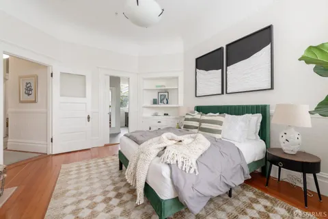 a kitchen with stainless steel appliances granite countertop a refrigerator a sink and a stove