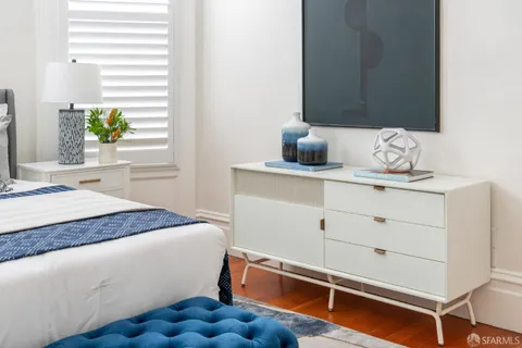 a spacious bedroom with a large bed and a window
