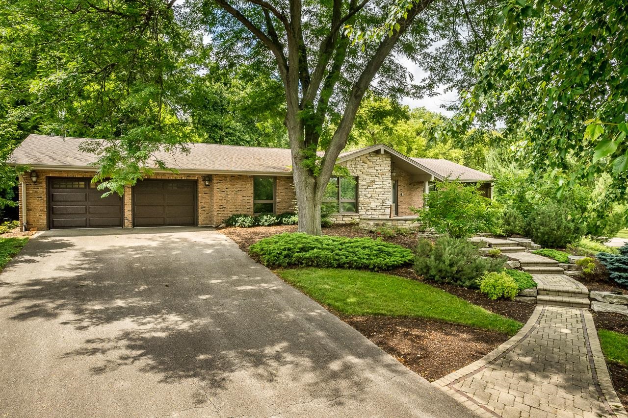10694 Saddle Path Road Belvidere, IL 61008 - Photo 1 of 49 a front view of a house with garden