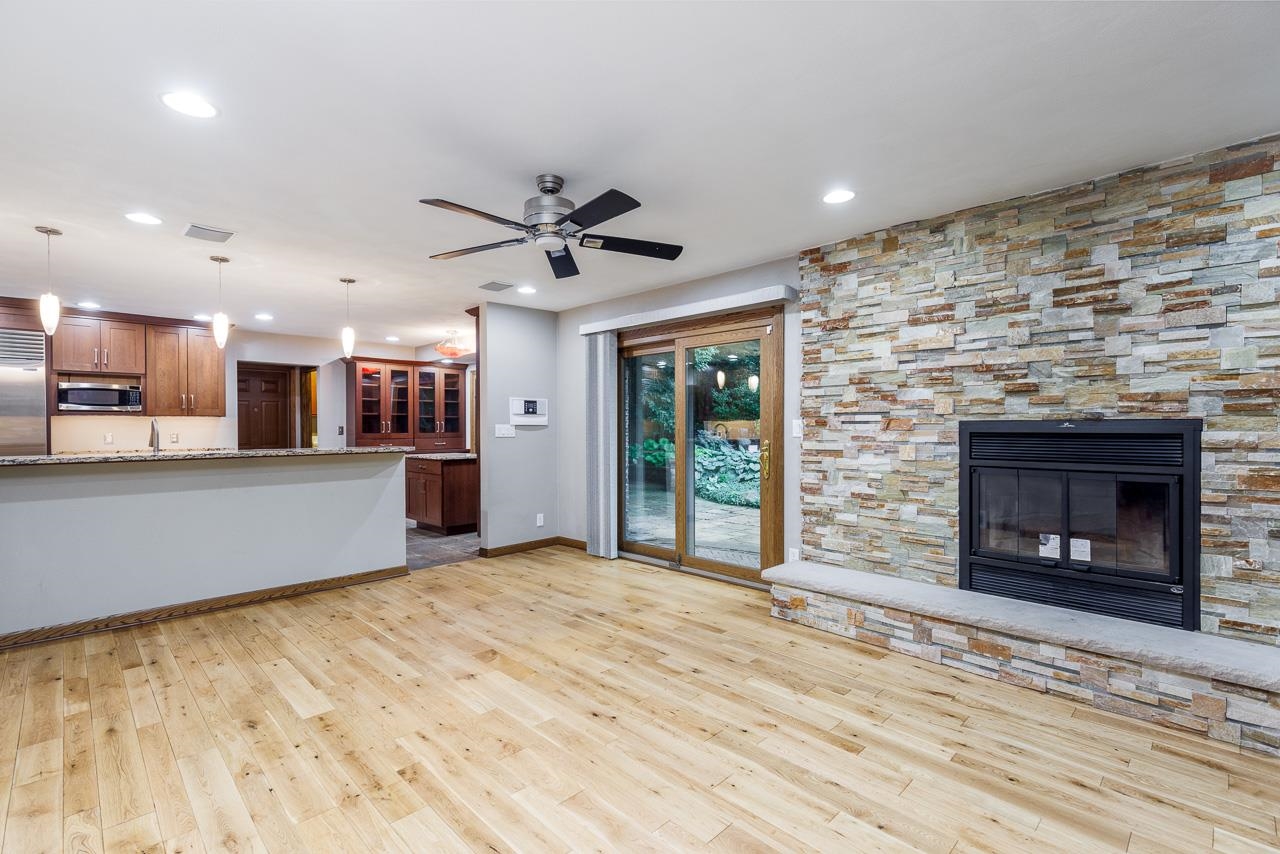 10694 Saddle Path Road Belvidere, IL 61008 - Photo 15 of 49 a view of a room with kitchen and fireplace