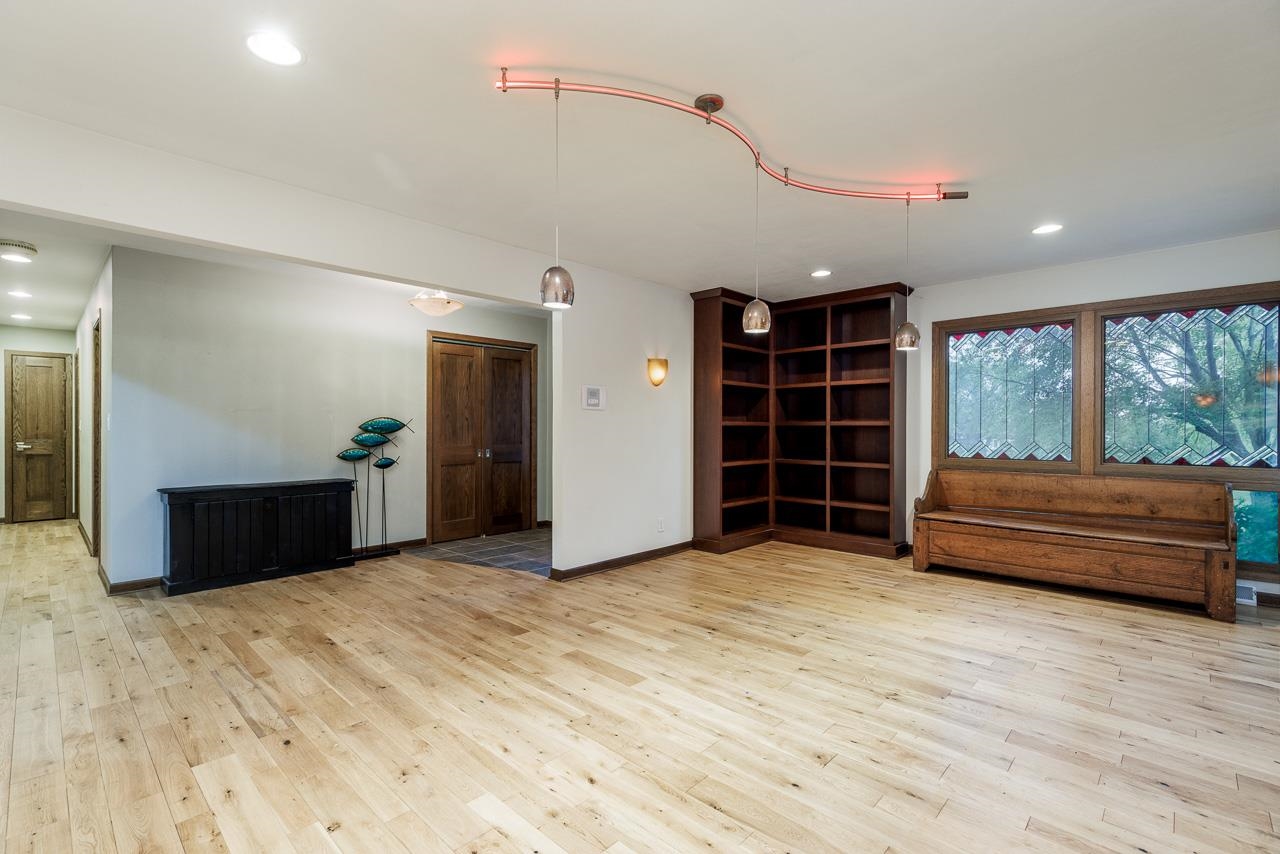 10694 Saddle Path Road Belvidere, IL 61008 - Photo 8 of 49 a view of an empty room with wooden floor and a window