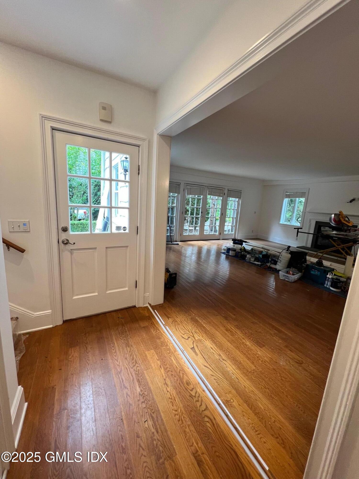 215 Old Church Road, Unit CARRIAGE HOUSE Greenwich, CT 06830 - Photo 2 of 14 a view of an empty room and window