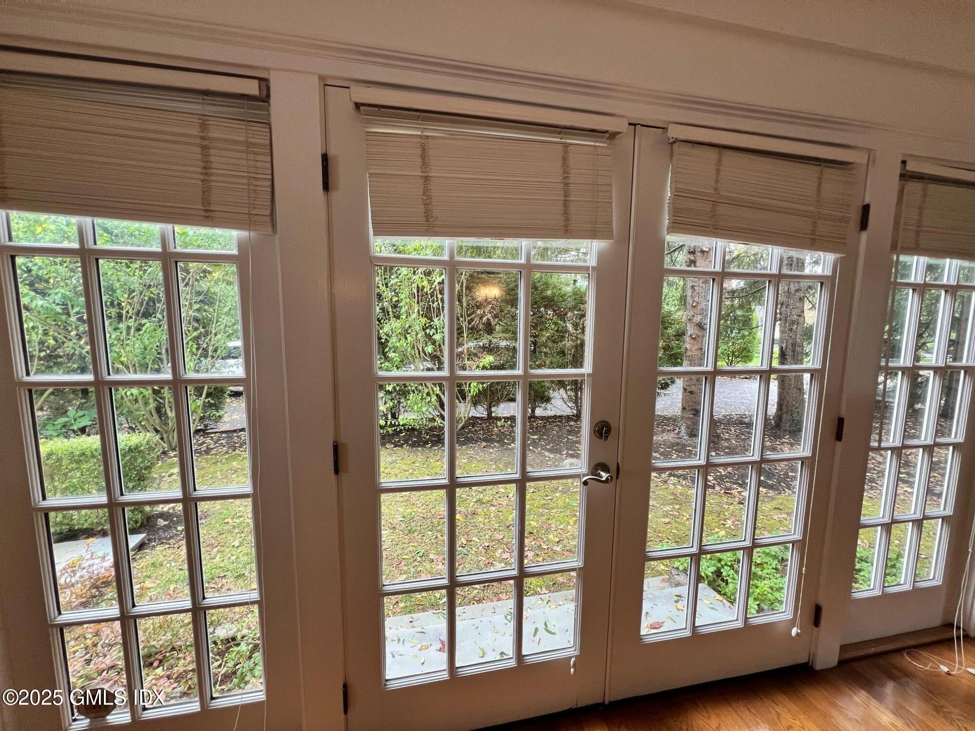 215 Old Church Road, Unit CARRIAGE HOUSE Greenwich, CT 06830 - Photo 3 of 14 a view of a room that has a large window