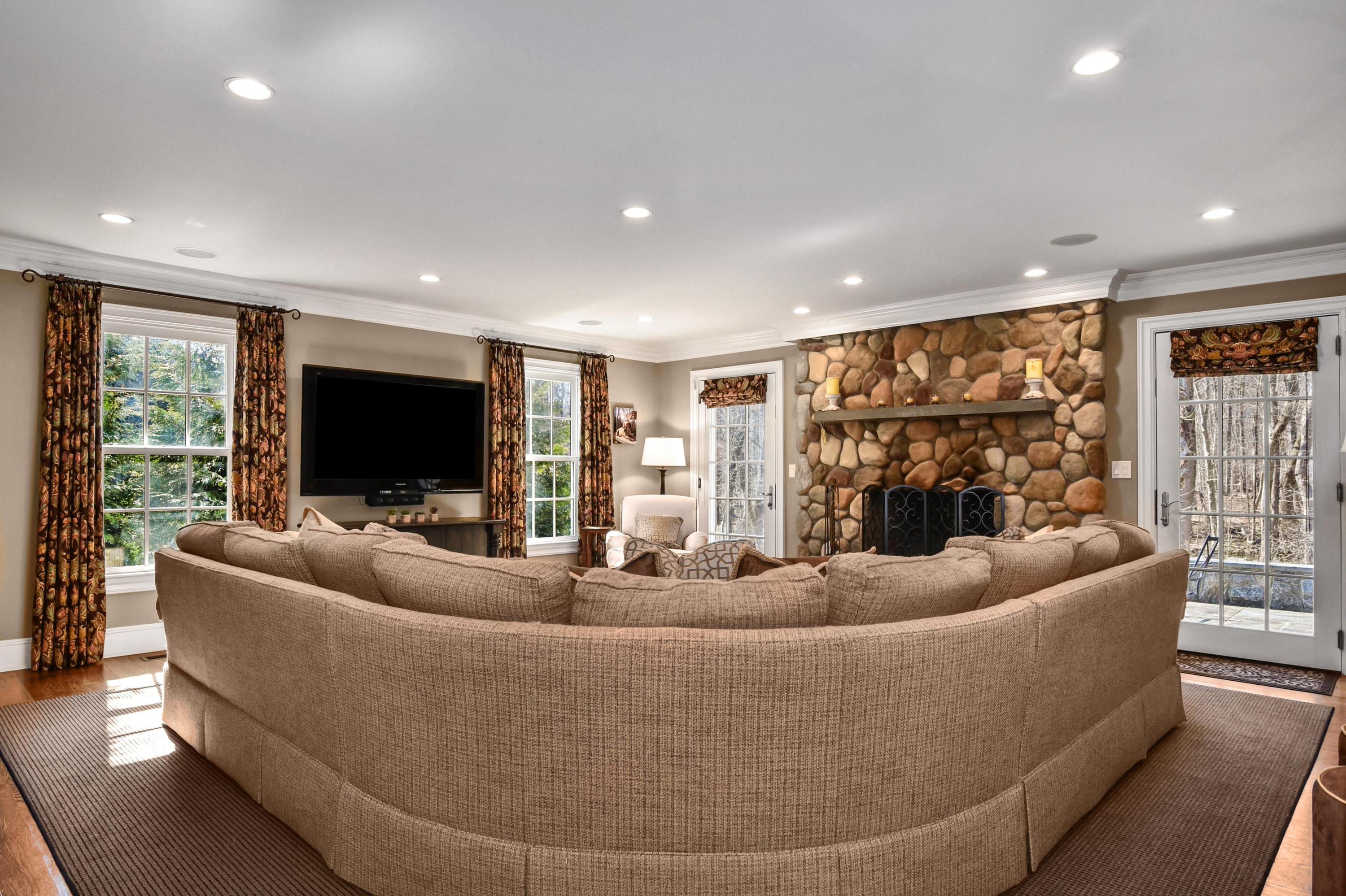 18 Colony Road Darien, CT 06820 - Photo 8 of 33 a living room with couch and a flat screen tv