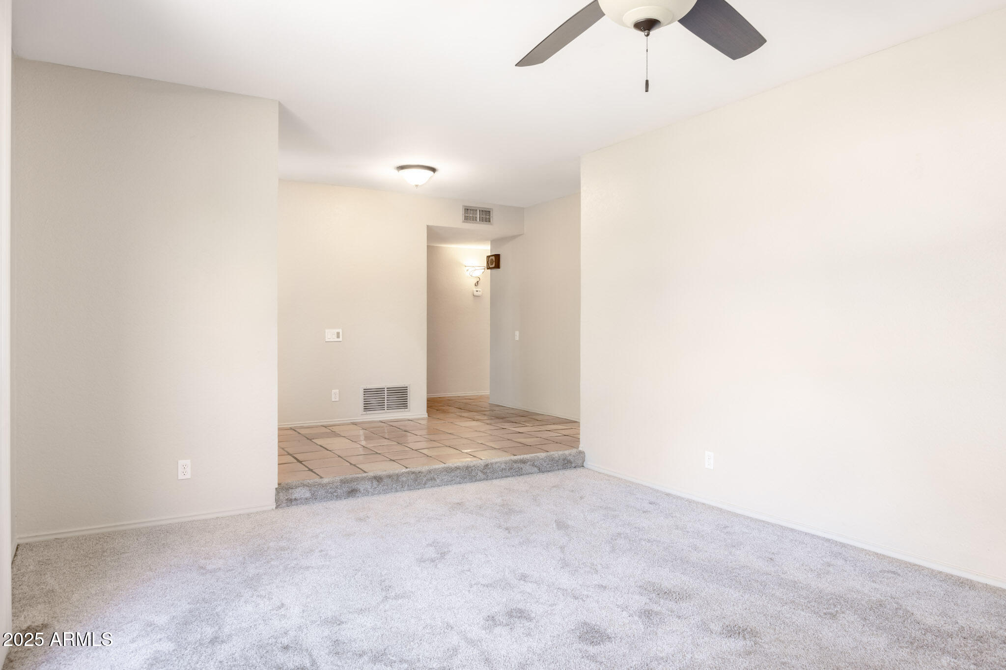 5701 East Sandy Lane Scottsdale, AZ 85254 - Photo 12 of 48 an empty room with ceiling fan and window