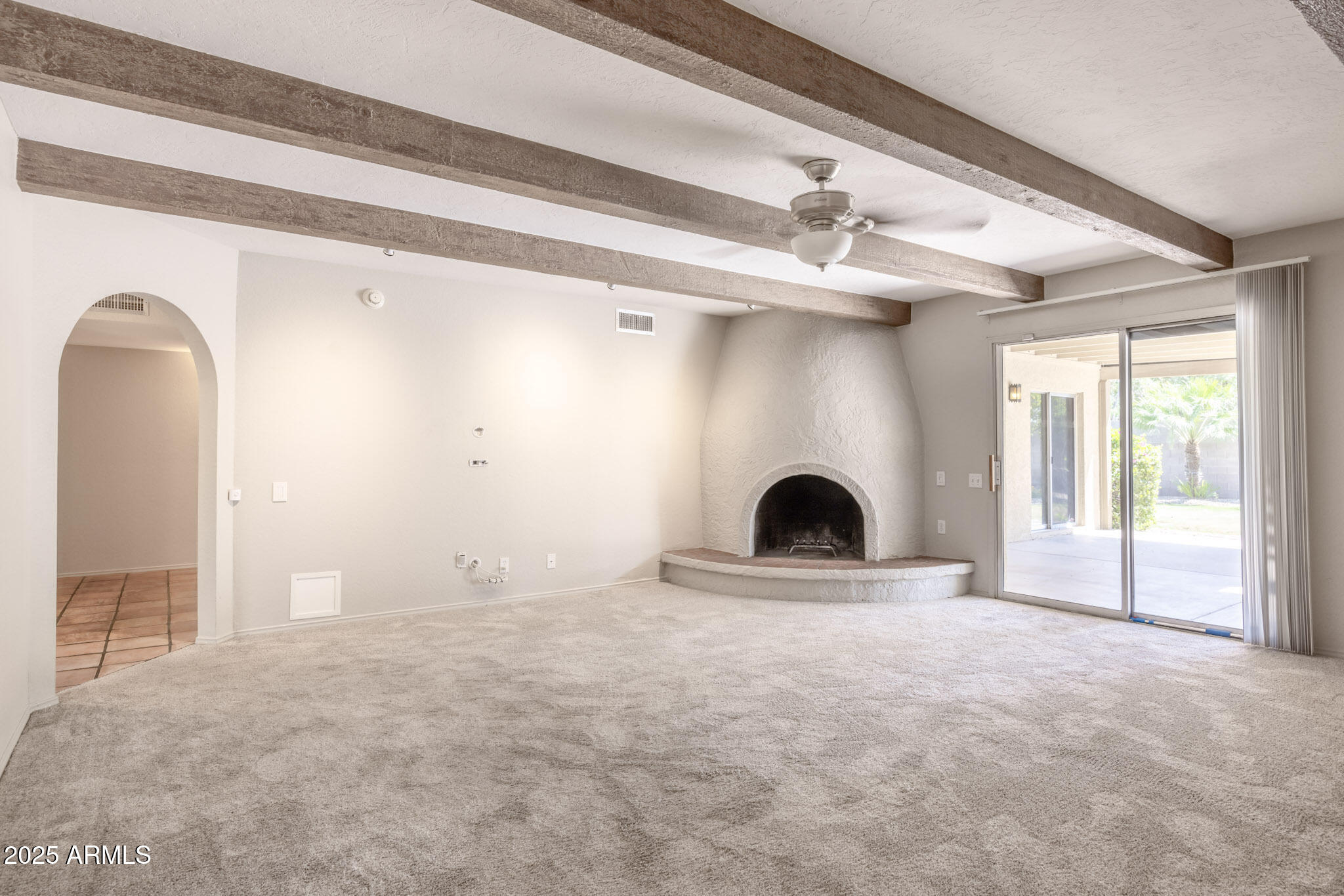 5701 East Sandy Lane Scottsdale, AZ 85254 - Photo 14 of 48 a view of a livingroom with a fireplace and window