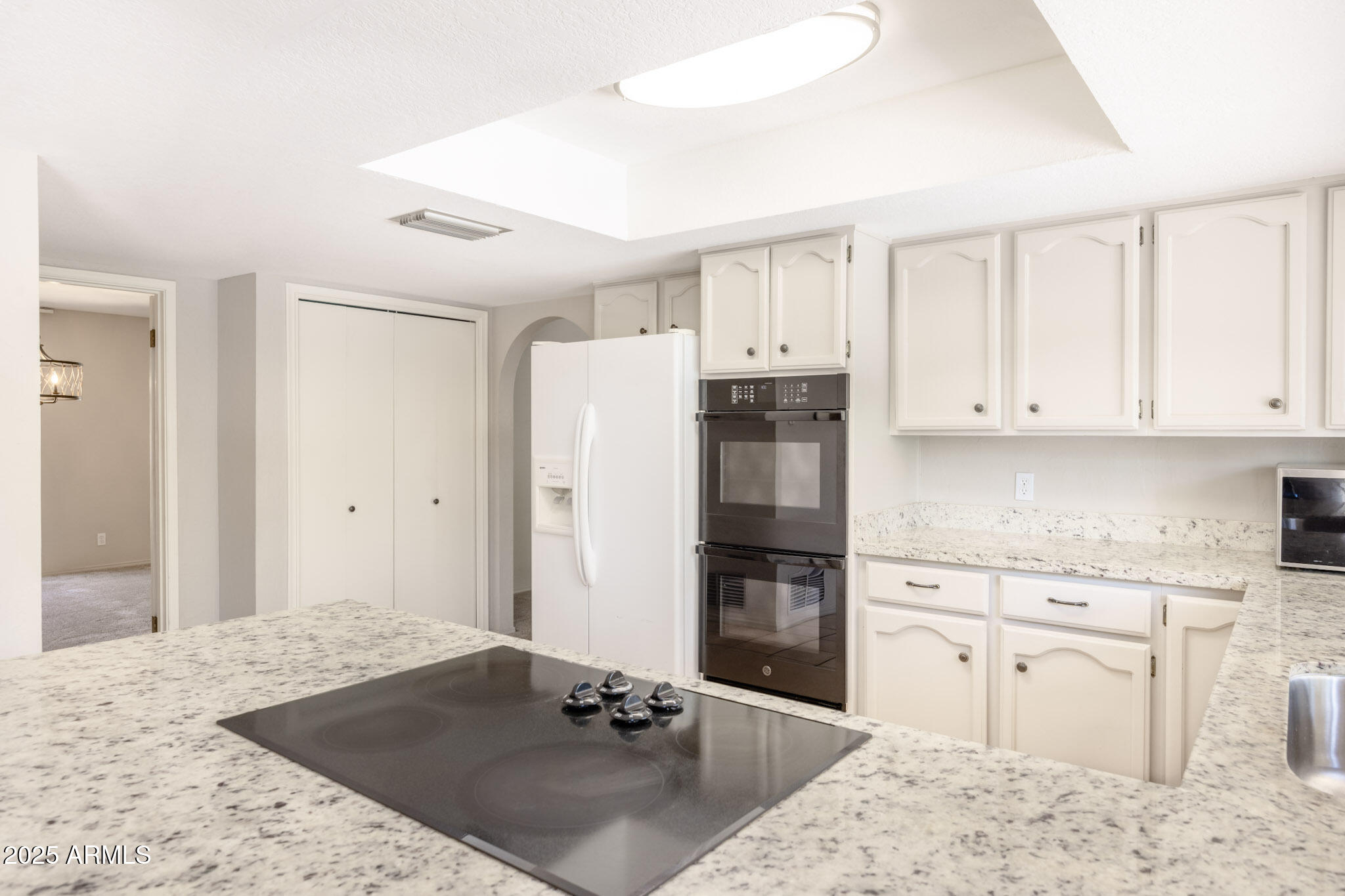5701 East Sandy Lane Scottsdale, AZ 85254 - Photo 20 of 48 a kitchen with granite countertop a stove a sink and a refrigerator