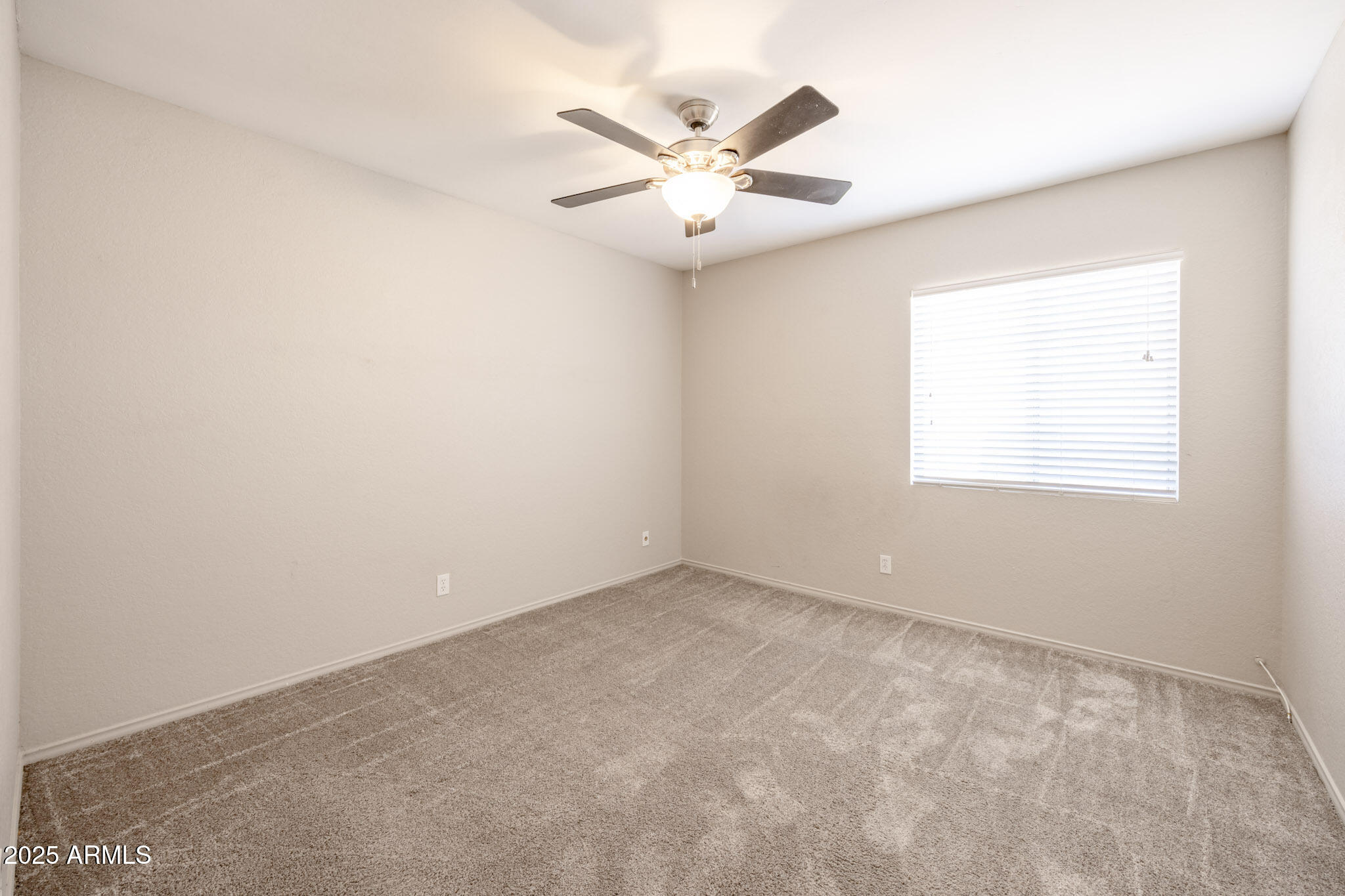 5701 East Sandy Lane Scottsdale, AZ 85254 - Photo 26 of 48 an empty room with windows and fan