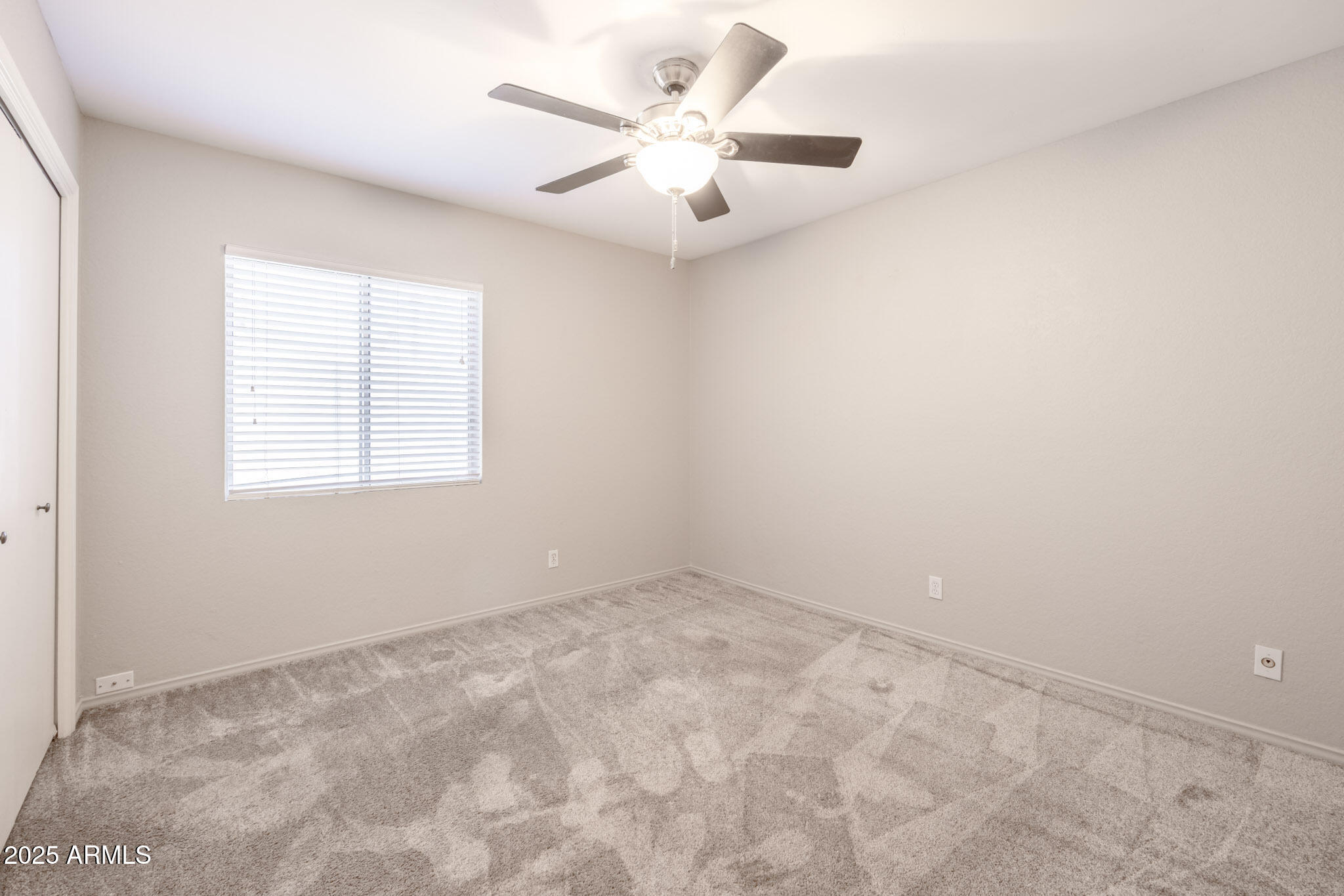 5701 East Sandy Lane Scottsdale, AZ 85254 - Photo 28 of 48 an empty room with windows and ceiling fan