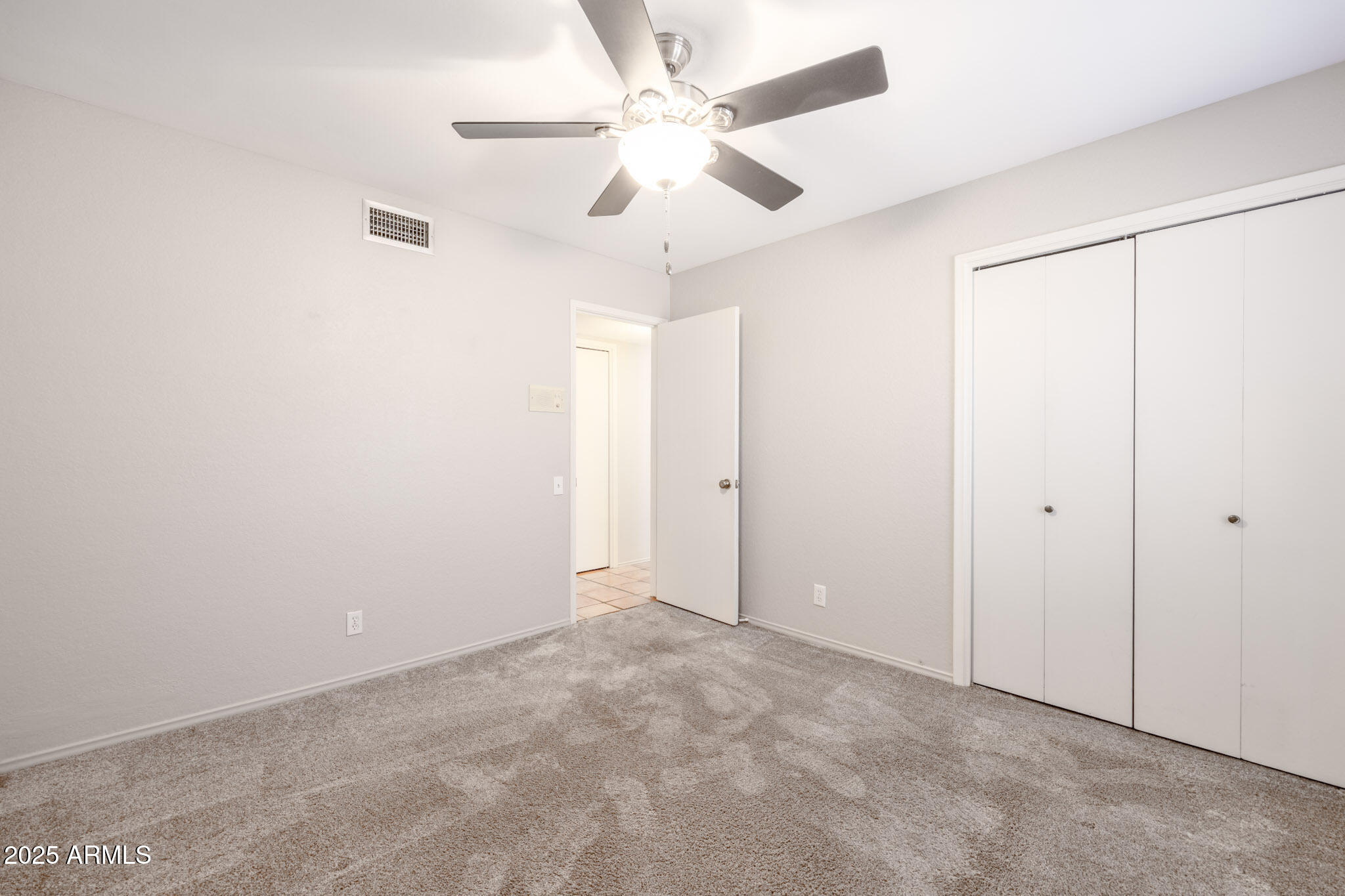 5701 East Sandy Lane Scottsdale, AZ 85254 - Photo 29 of 48 an empty room with fan and entryway
