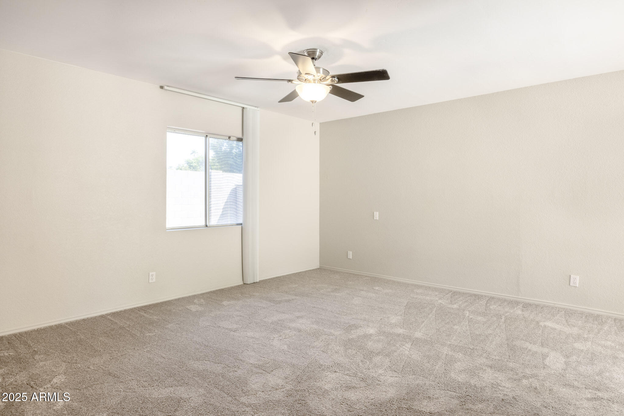5701 East Sandy Lane Scottsdale, AZ 85254 - Photo 30 of 48 an empty room with windows and fan
