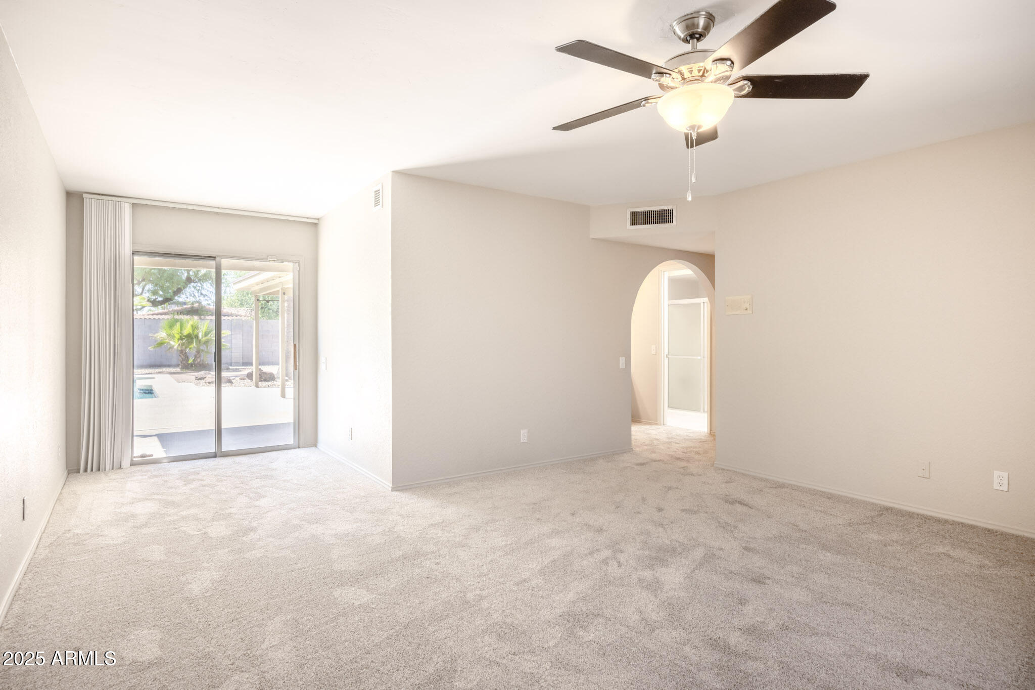5701 East Sandy Lane Scottsdale, AZ 85254 - Photo 32 of 48 an empty room with a fan & a window