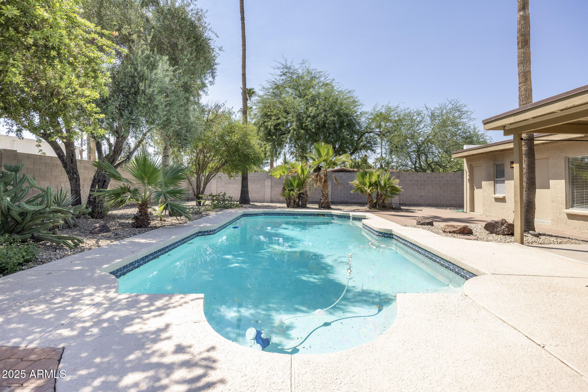 5701 East Sandy Lane Scottsdale, AZ 85254 - Photo 38 of 48 a view of a swimming pool with a patio