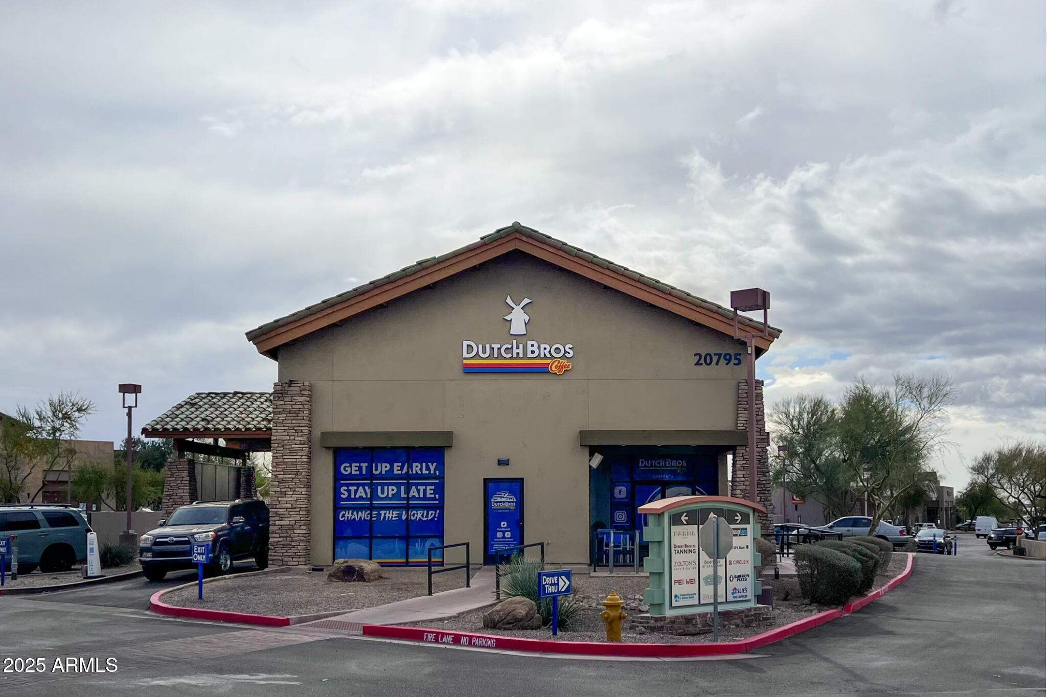 5701 East Sandy Lane Scottsdale, AZ 85254 - Photo 44 of 48 a front view of a house with garden