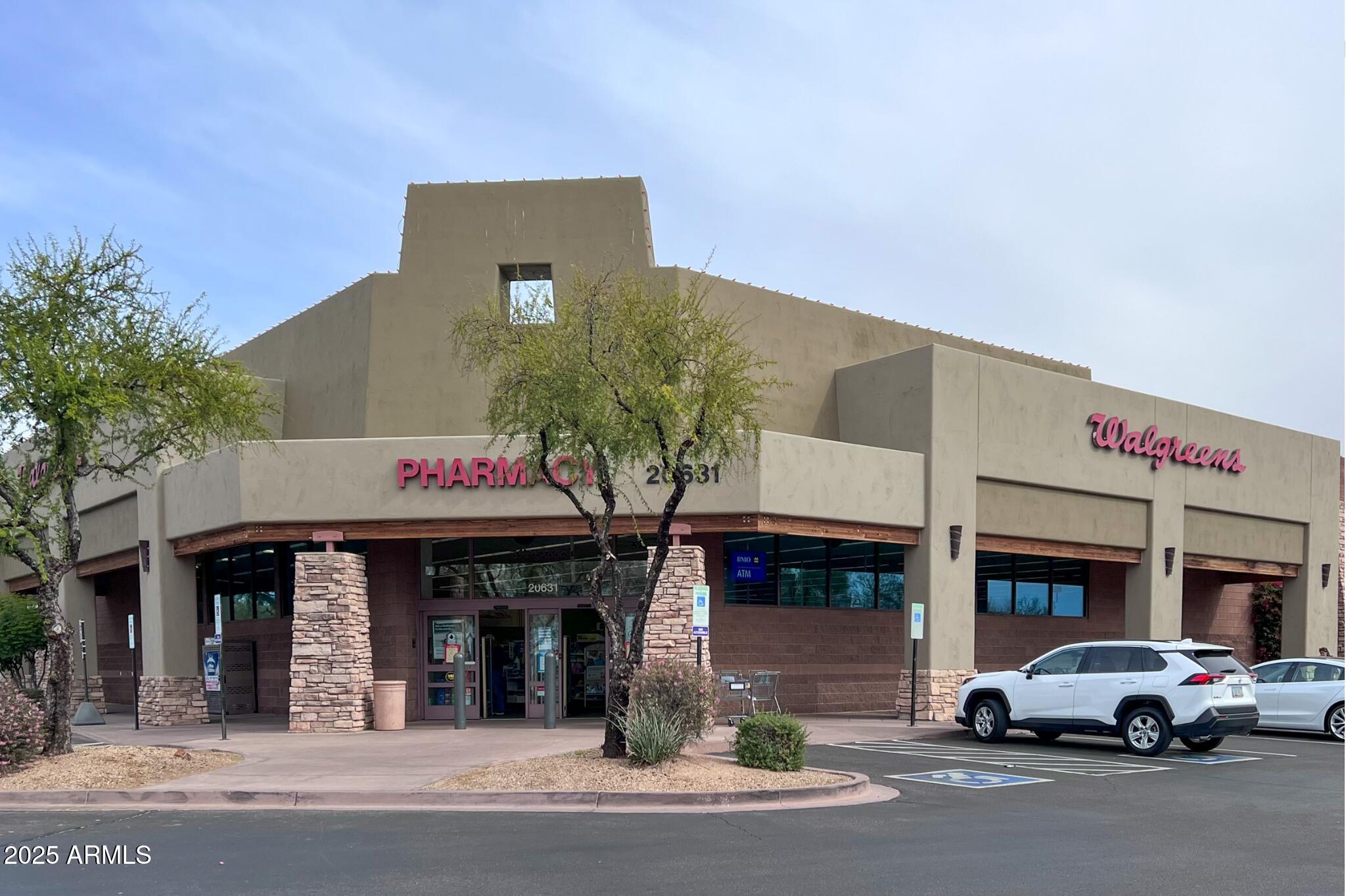 5701 East Sandy Lane Scottsdale, AZ 85254 - Photo 45 of 48 a car parked in front of a building