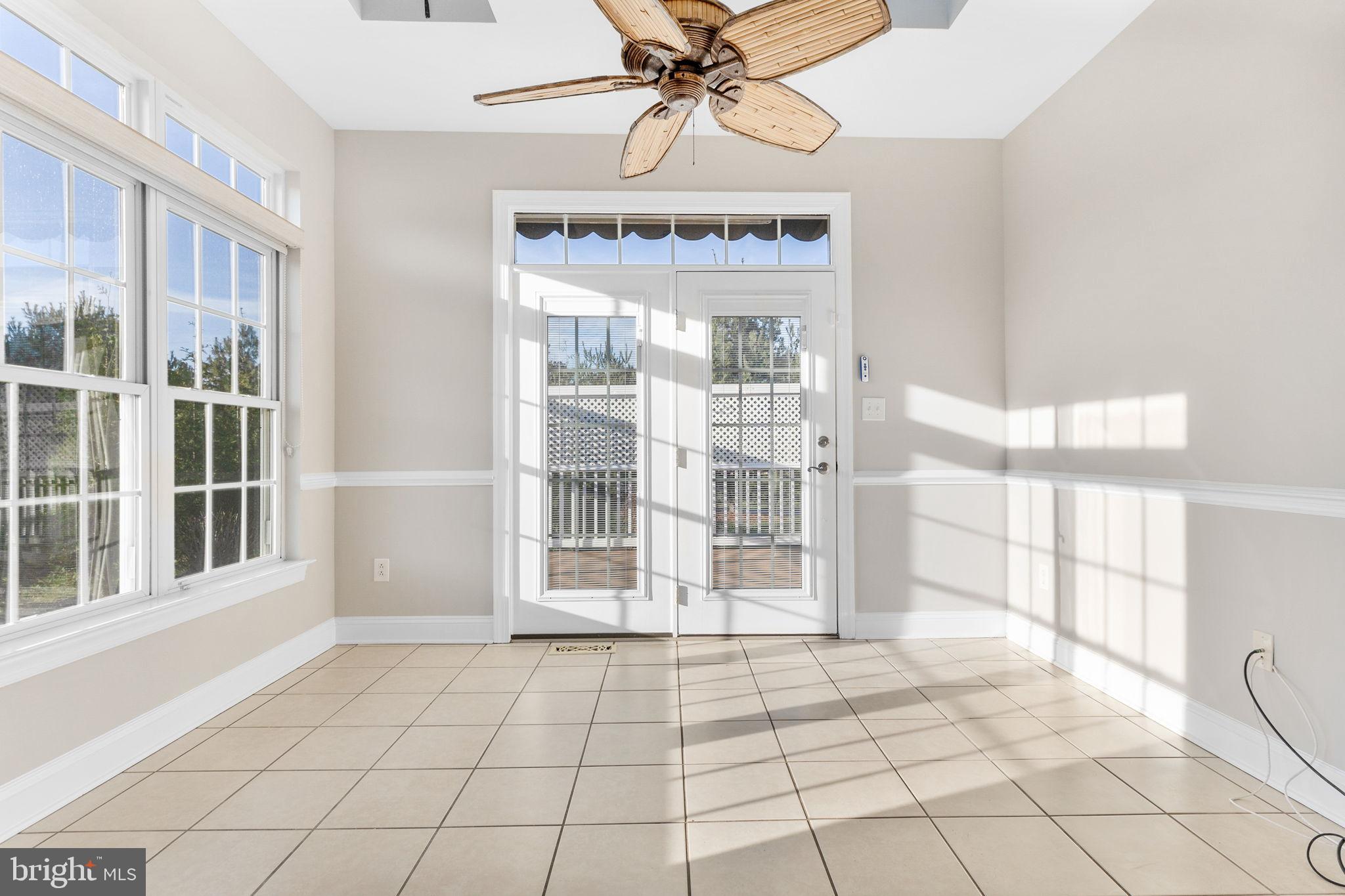 81 Devalinder Drive Newark, DE 19702 - Photo 11 of 43 Sunroom leads out to a large private deck