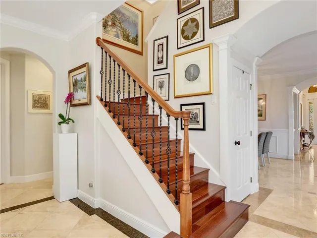 a view of stairs and an front door