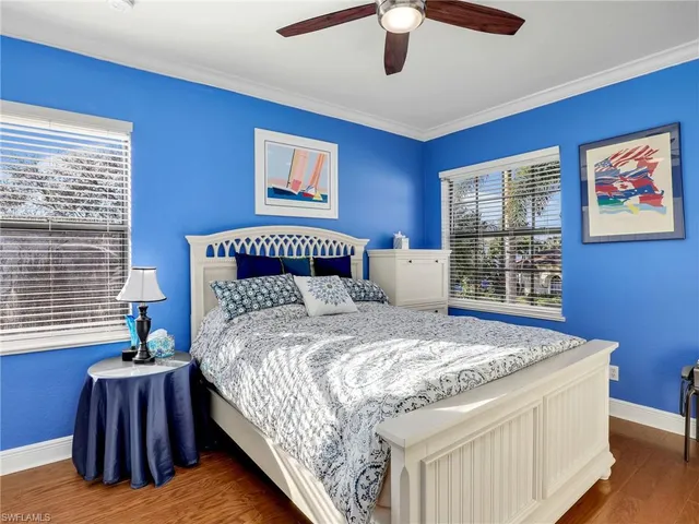 a bedroom with bed and a window