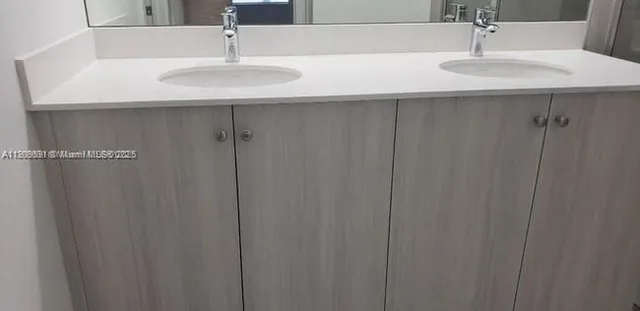 a kitchen that has a refrigerator a stove and a sink