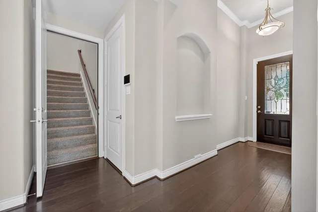 a view of an empty room with a ceiling fan