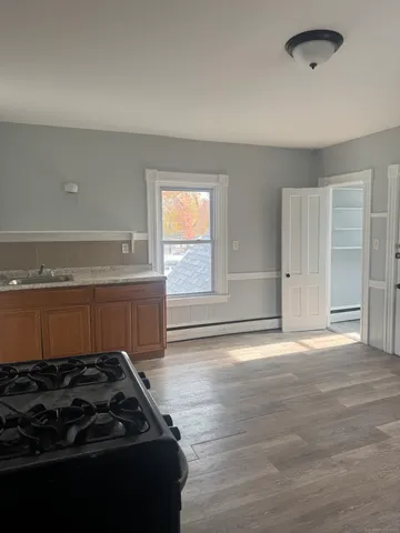 a kitchen with a stove and a refrigerator