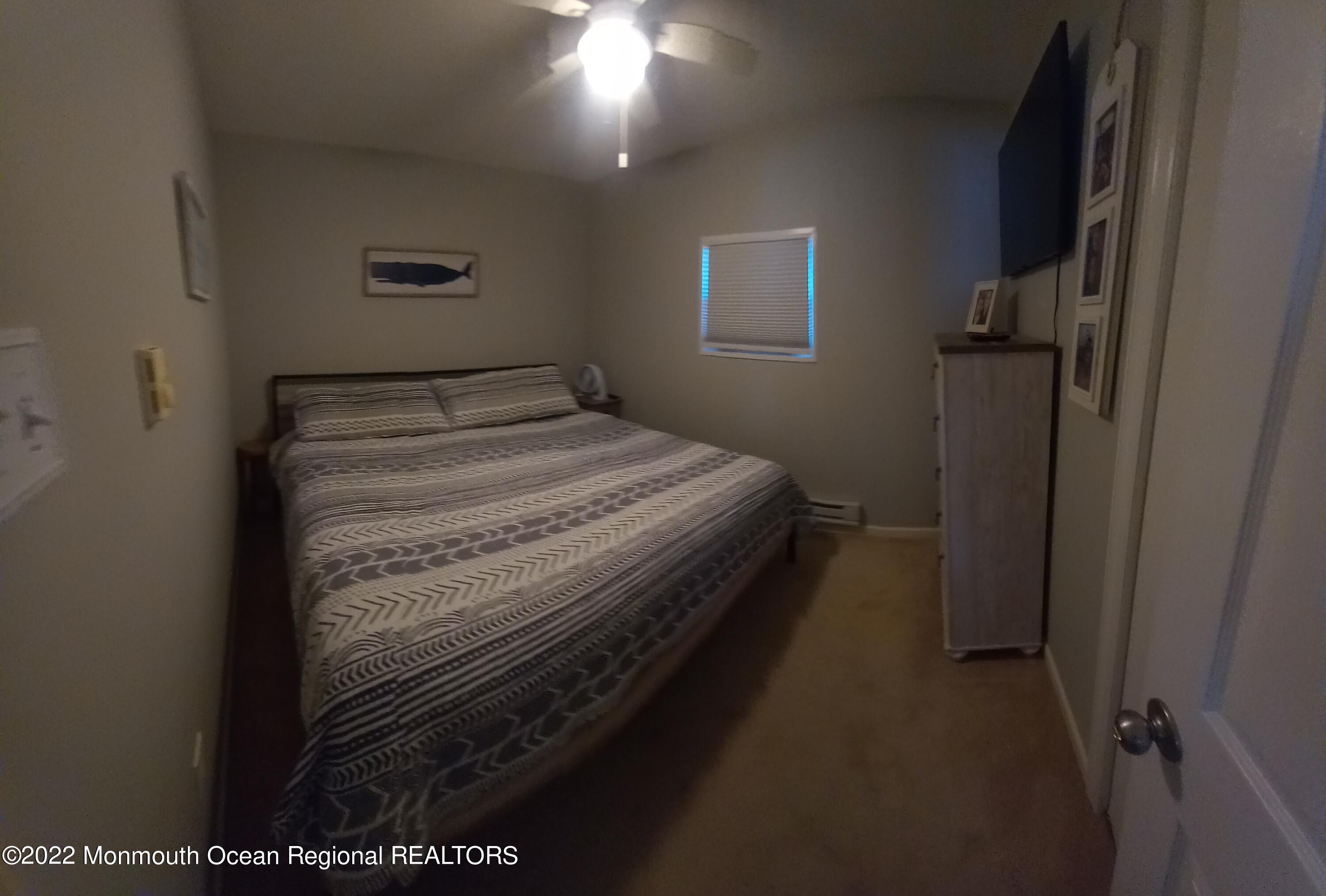 22 Ship Drive Little Egg Harbor, NJ 08087 - Photo 20 of 45 a bedroom with a bed and a window