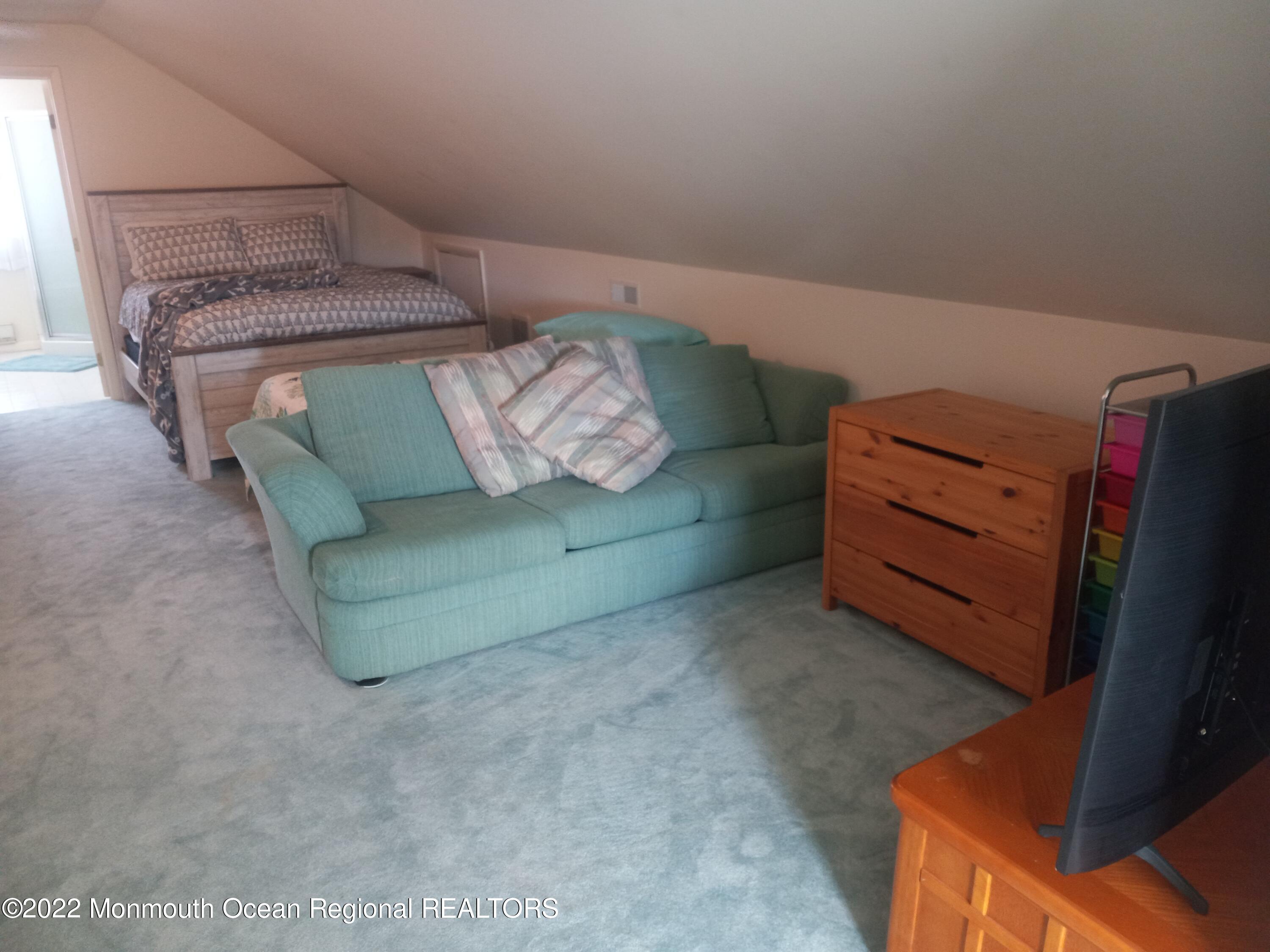 22 Ship Drive Little Egg Harbor, NJ 08087 - Photo 27 of 45 a living room with furniture and a flat screen tv