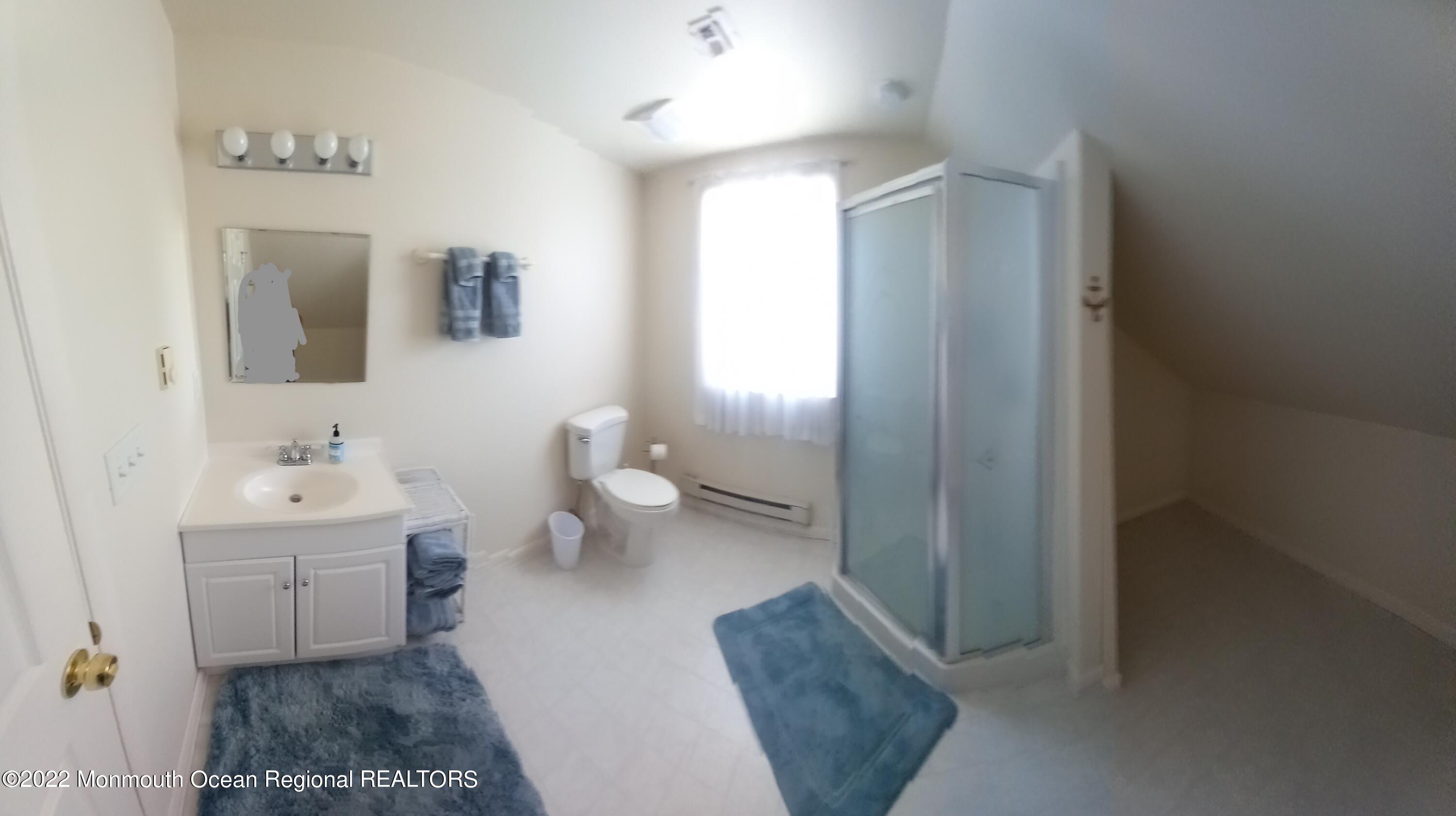 22 Ship Drive Little Egg Harbor, NJ 08087 - Photo 30 of 45 a en suite bathroom with a toilet sink and mirror