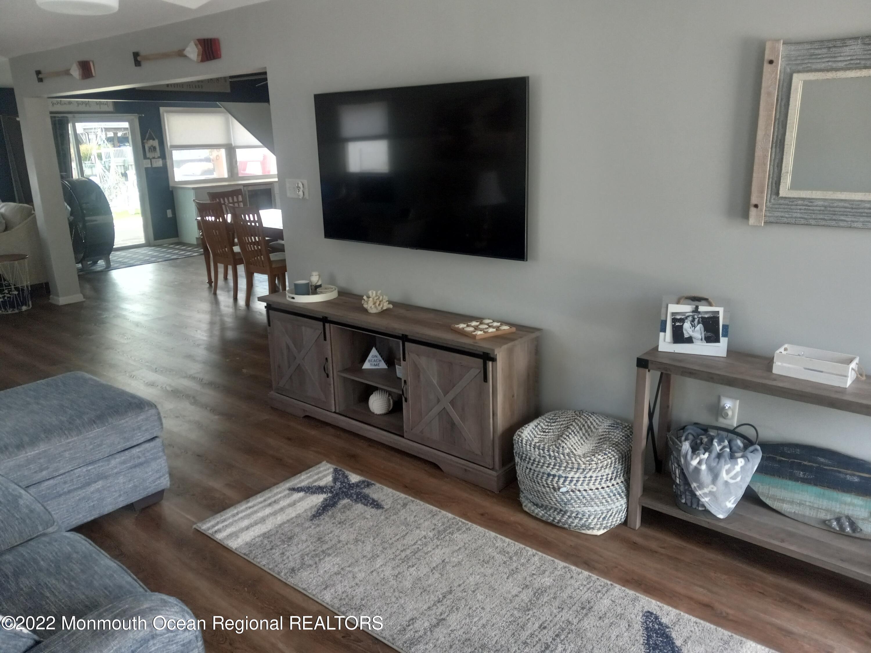 22 Ship Drive Little Egg Harbor, NJ 08087 - Photo 7 of 45 a living room with furniture and a flat screen tv