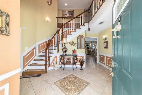 a view of entryway livingroom and hall with wooden floor
