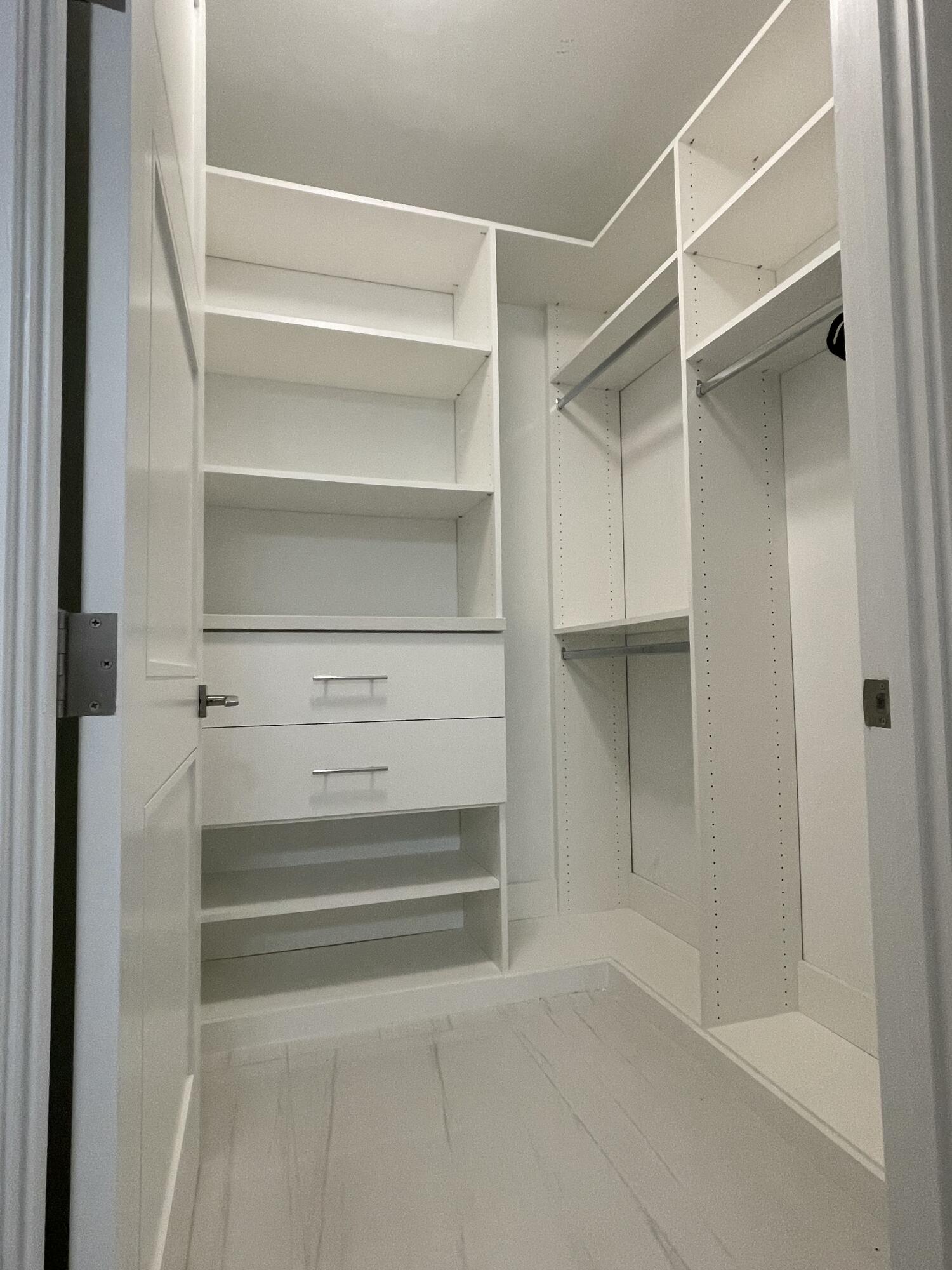 155 East Boca Raton Road, Unit 313 Boca Raton, FL 33432 - Photo 13 of 35 a view of walk in closet with empty racks