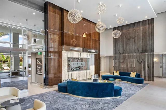 a view of a living room and kitchen