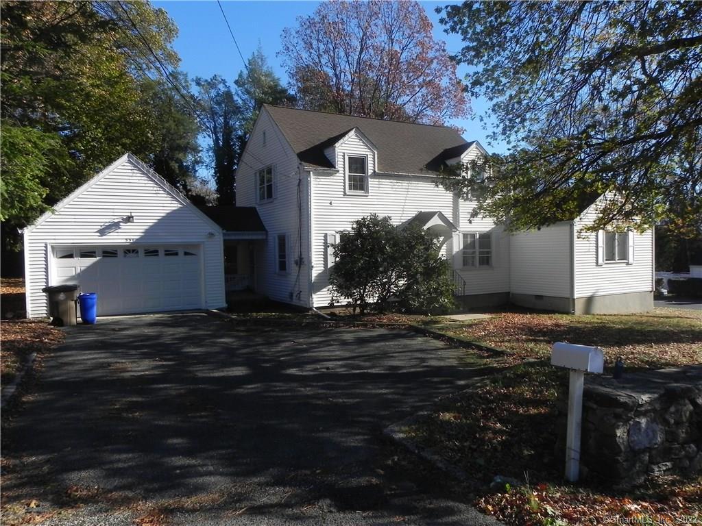 551 High Ridge Road Stamford, CT 06905 - Photo 1 of 1 a front view of a house with a yard