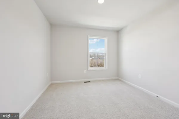 an empty room with closet area