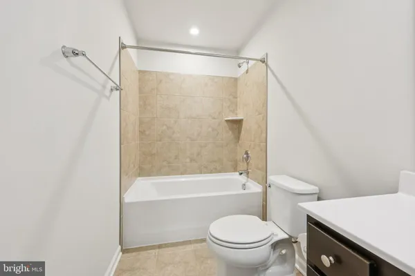 a view of an empty room and closet area